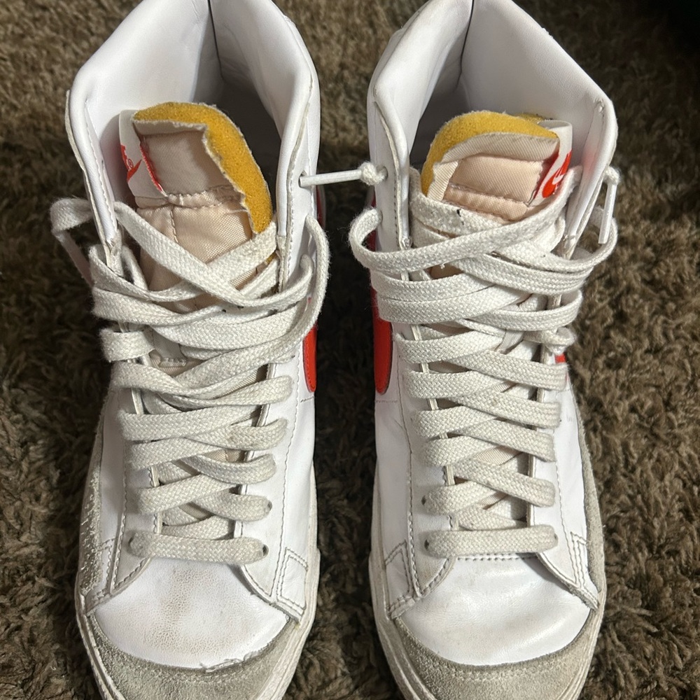 Nike White Sneakers with Subtle Red Details